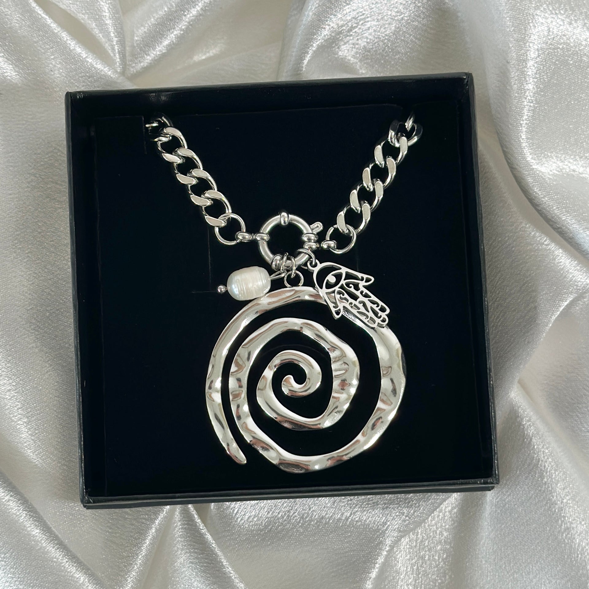 SILVER SWIRL CHARM.